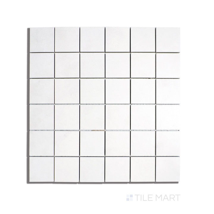 Flat lay of Creos Bride 2" Square Matte Porcelain Mosaic, featuring small-scale neutral-toned tiles with a smooth matte finish for intricate designs.