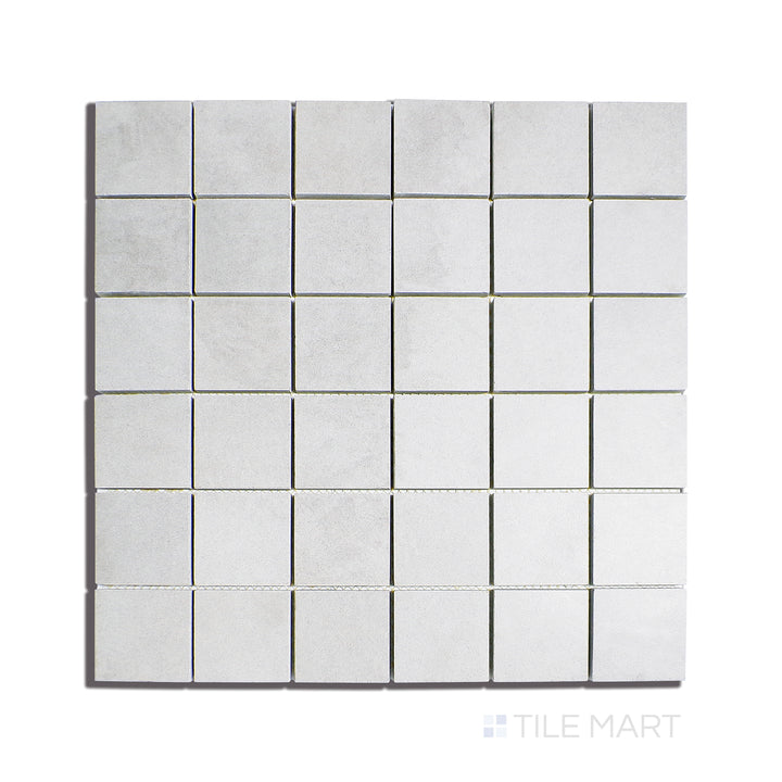 Overhead view of Creos Dorian 2" Square Matte Porcelain Mosaic, displaying soft grey tones with a matte finish in a versatile mosaic pattern.