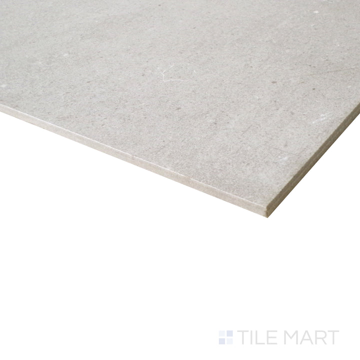 A close-up angle enhances the aqua hues of this honed porcelain tile, bringing out its smooth yet dynamic surface.