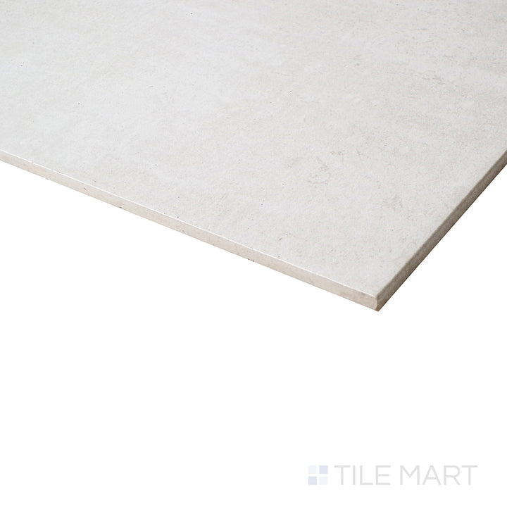 An angled view emphasizes the melted ice color, showcasing the sleek honed finish and soft natural veining.