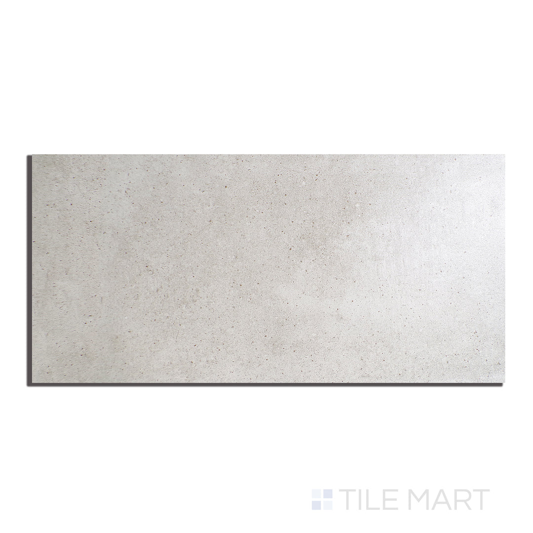 Close-up view of Ecocrete Melted Ice 18X36 Honed Porcelain, offering a soft, icy neutral shade with a smooth honed finish, ideal for minimalist and modern designs.