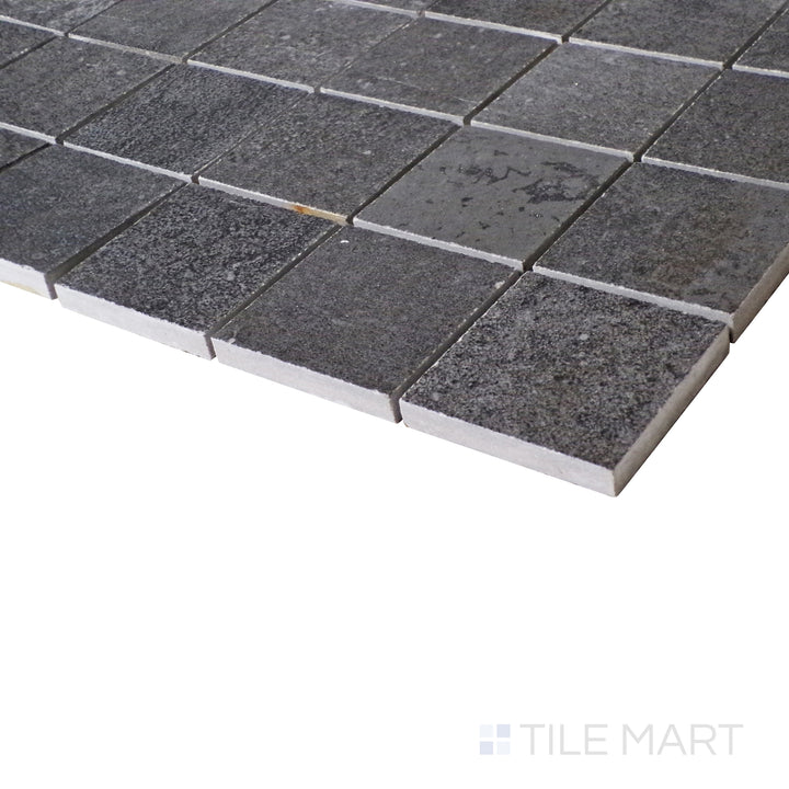 A deep, weathered black hue is brought to life in this side-view shot, accentuating the structured grid pattern of the matte mosaic.