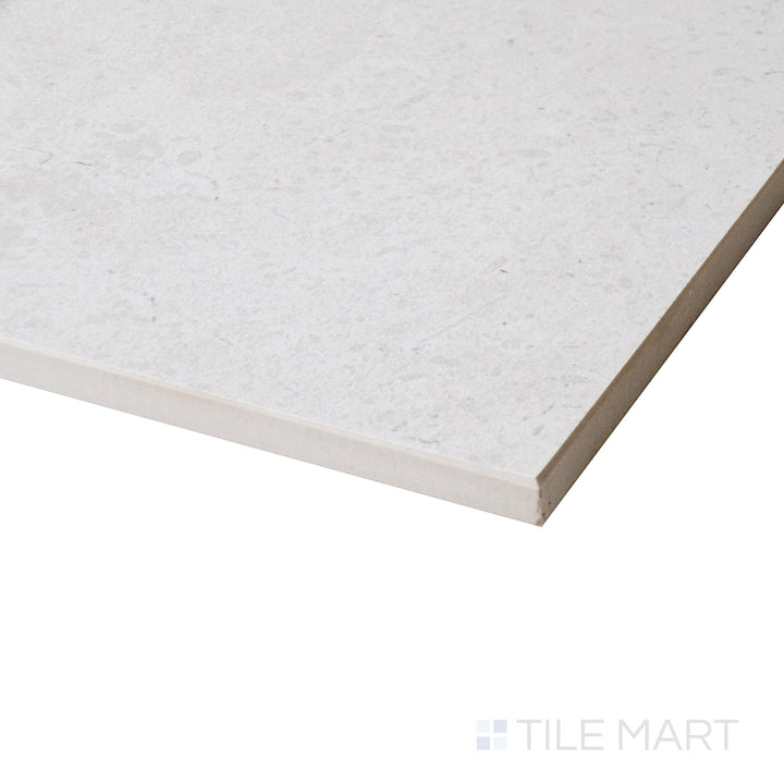 A side-angle shot enhances the warm almond tones, highlighting the soft matte surface and its natural stone-like finish.