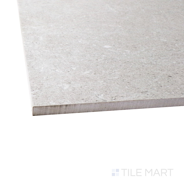 Captured from a corner angle, the Epika Pearl 12x24 matte porcelain tile showcases its subtle pearl-white shade and velvety matte surface, offering a refined and elegant touch.