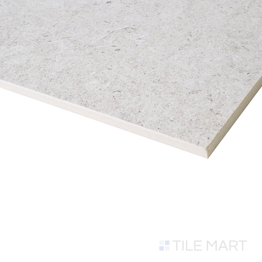 An angled close-up captures the subtle pearl hues and smooth matte texture, creating a refined and contemporary aesthetic.