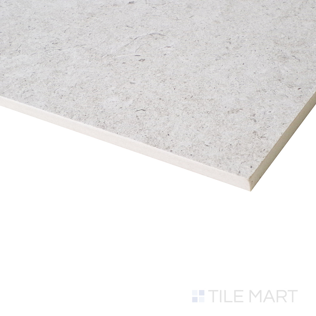 An angled close-up captures the subtle pearl hues and smooth matte texture, creating a refined and contemporary aesthetic.