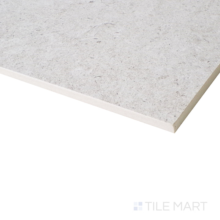 From an angled view, this soft shell-colored porcelain tile reveals a clean, modern look with a beautifully muted matte finish.