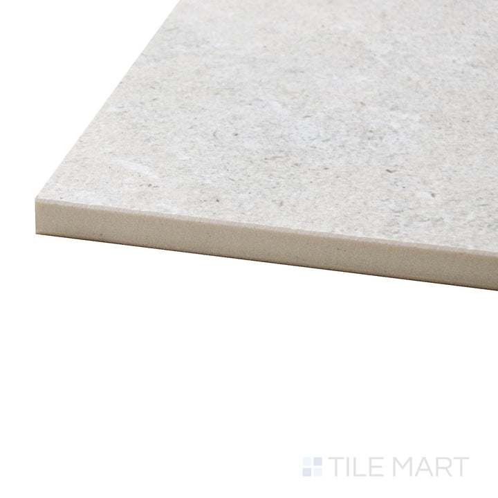 A corner shot of the Epika Shell 48x48 matte porcelain tile highlights its neutral and earthy undertones, creating a warm yet contemporary foundation for any space.