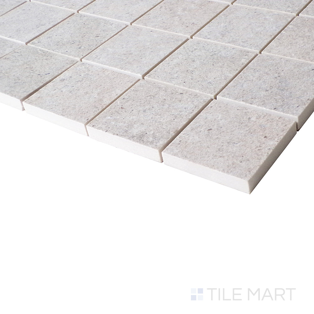 A side-angle perspective highlights the structured grid of this almond-toned mosaic, with a matte finish that adds a refined touch.