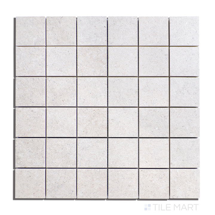 Overhead shot of Epika Almond 2" Square Matte Porcelain Mosaic, featuring warm almond hues in a small mosaic pattern, adding a cozy touch to any space.