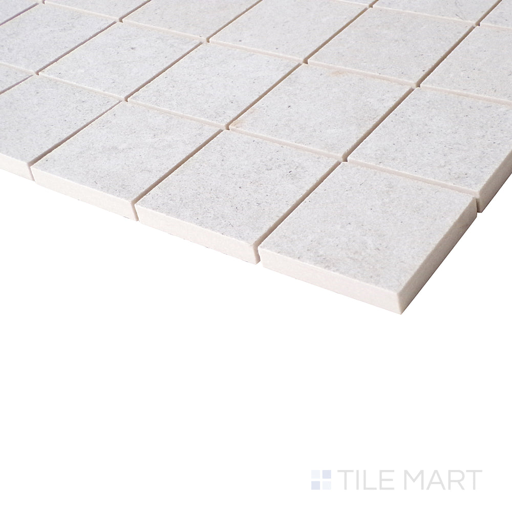 An angled close-up showcases the pearl-colored mosaic, with a soft matte texture that enhances its sophisticated and modern appeal.