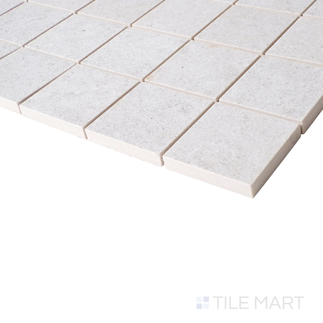 An angled close-up showcases the pearl-colored mosaic, with a soft matte texture that enhances its sophisticated and modern appeal.