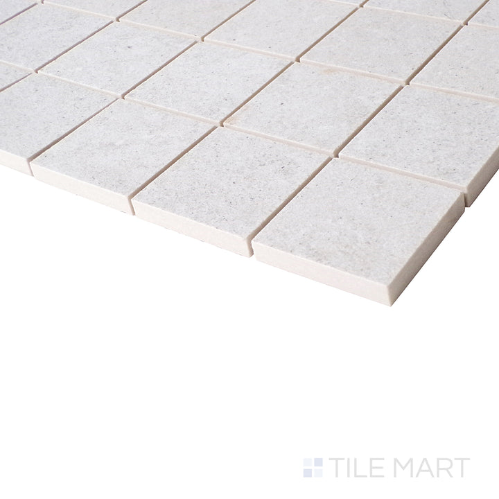 An angled close-up showcases the pearl-colored mosaic, with a soft matte texture that enhances its sophisticated and modern appeal.