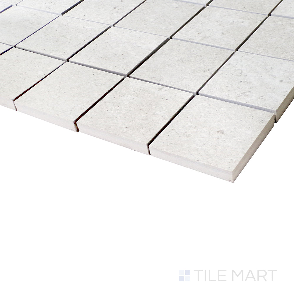 A zoomed-in side shot emphasizes the shell-toned mosaic pattern, capturing the clean matte surface and balanced layout.