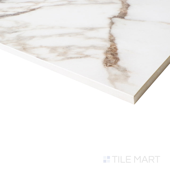 An angled perspective enhances the elegant white backdrop and intricate Arabescato marble-inspired veins with a radiant polished finish.