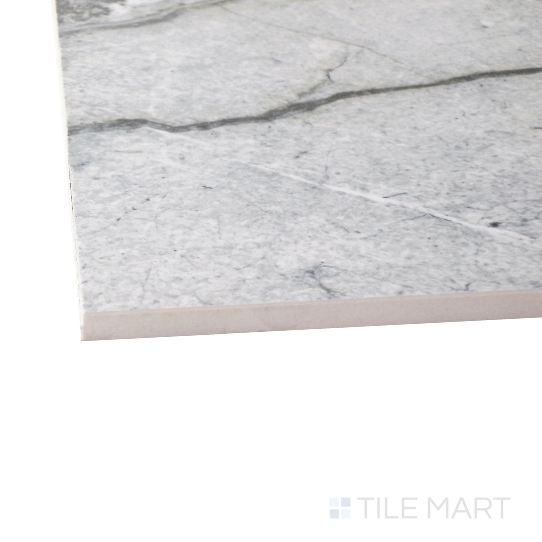 A corner perspective of the Exotic Stone Cosmopolitan Mystic Grey 24x48 polished porcelain tile emphasizes its moody gray hues and reflective surface, creating depth and sophistication.