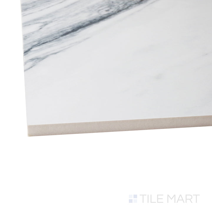 A corner shot of the Exotic Stone Cosmopolitan Statuario Fantastico 24x48 polished porcelain tile highlights its luxurious white marble pattern with bold veining, perfect for statement designs.