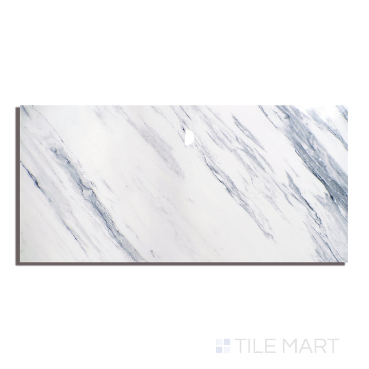 Aerial view of Exotic Stone Cosmopolitan Statuario Fantastico 24X48 Polished Porcelain, presenting bold veining on a bright white backdrop for a statement marble look.