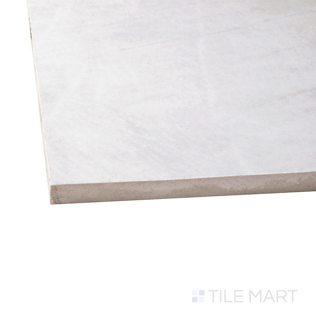 Captured from a corner angle, the Exotic Stone Da Vinci White 24x48 polished porcelain tile showcases its crisp white tone and high-gloss finish, offering a refined and radiant ambiance.