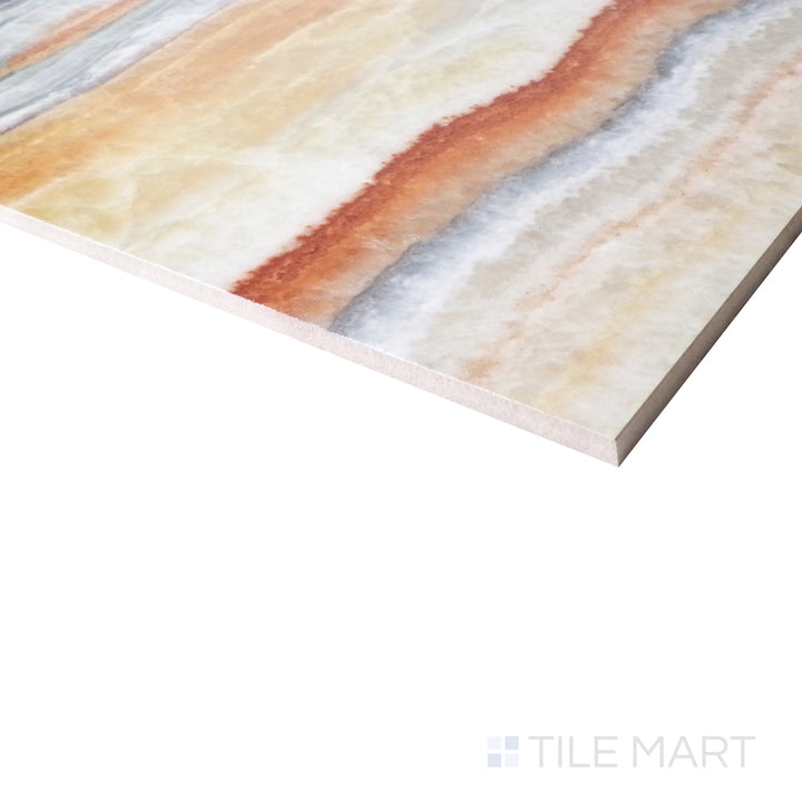 From an angled view, the luxurious Onice Fantastico design glows with opulent golden and cream veining over a sleek polished finish.