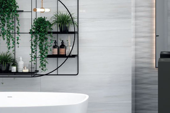 A refined and luminous lifestyle composition with Exotic Stone Nawan Kendo Pearl polished porcelain, creating an effortlessly chic ambiance.