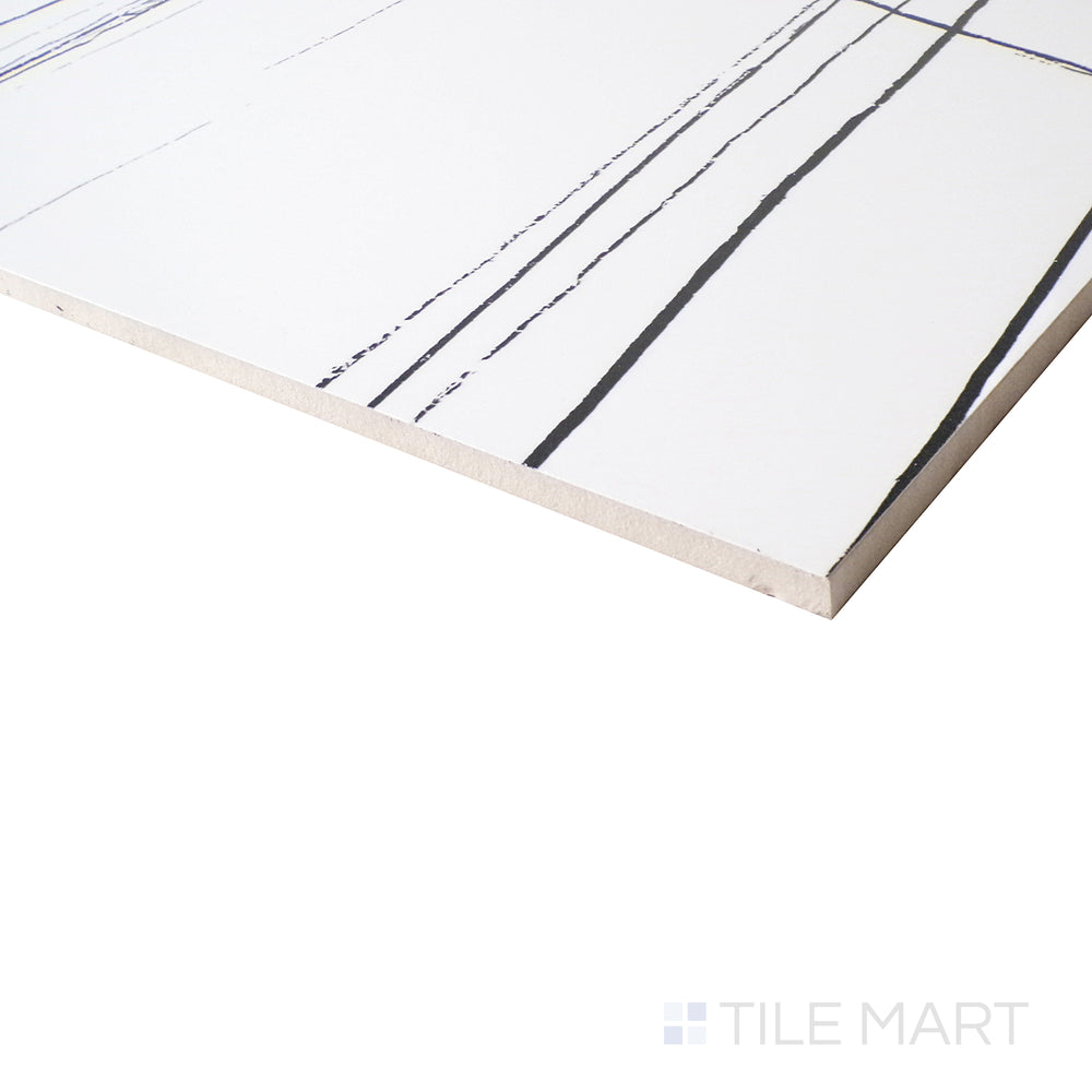 A softly-lit side shot emphasizes the pristine Sahara White backdrop, adorned with delicate veining and a luminous polished finish.