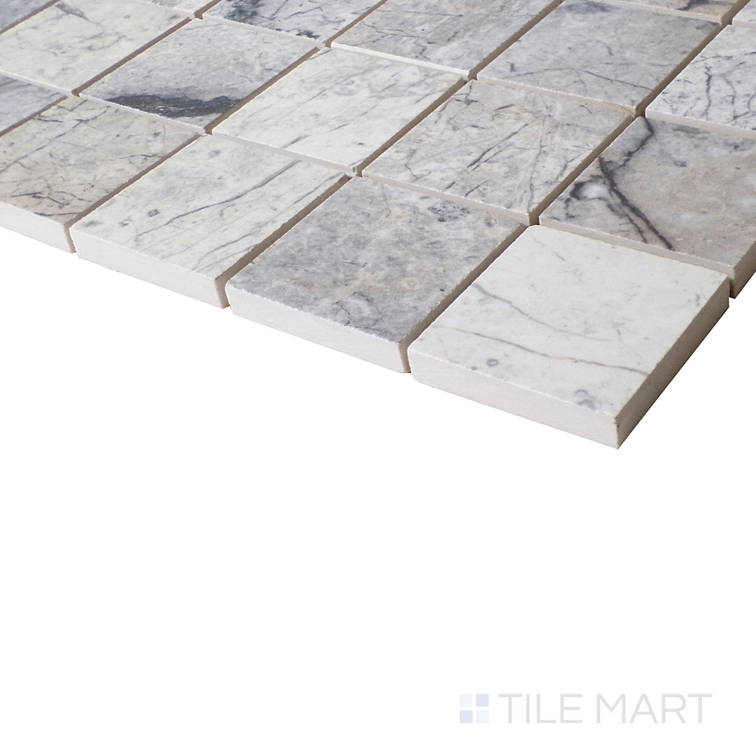 A side view captures the balanced contrast of Mystic Grey, with its reflective polished surface emphasizing the delicate mosaic pattern.