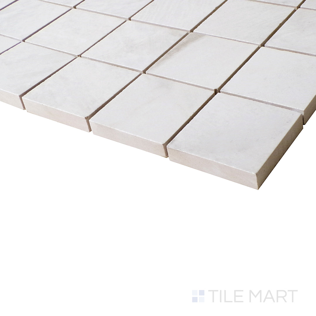 From a close side perspective, Da Vinci White mosaic tiles shimmer with polished perfection, enhancing the neutral and elegant appeal.