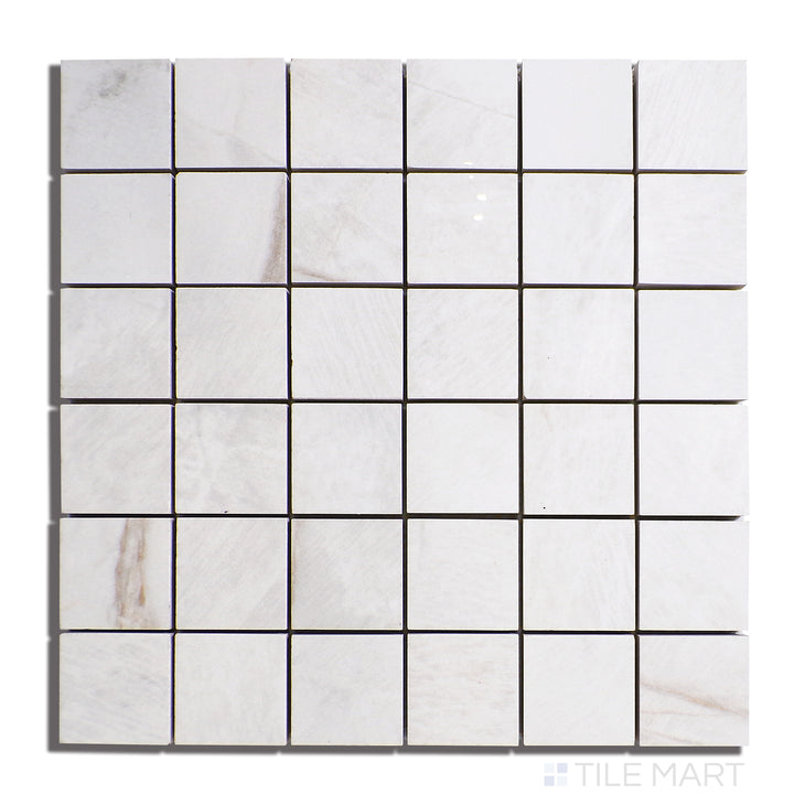 Aerial view of Exotic Stone Da Vinci White 2" Square Polished Porcelain Mosaic, highlighting its pristine white surface with subtle veining in a polished texture.