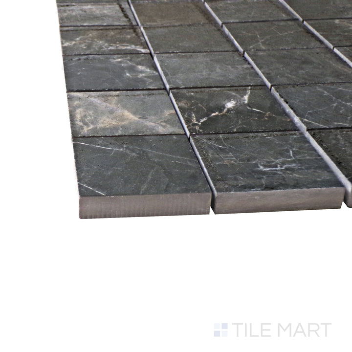 Captured from a corner angle, the Exotic Stone Gray Soveraya 2" square polished porcelain mosaic tile showcases its cool gray hues and smooth glossy texture, enhancing its contemporary appeal.