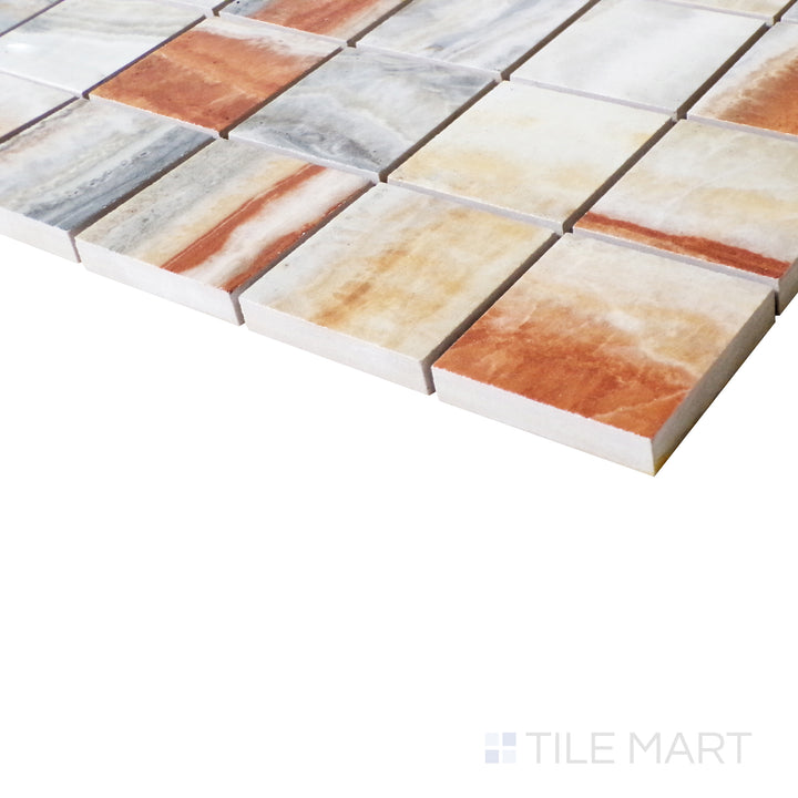 An angled view magnifies the luxurious warmth of Onice Fantastico, where each polished tile reflects light beautifully.