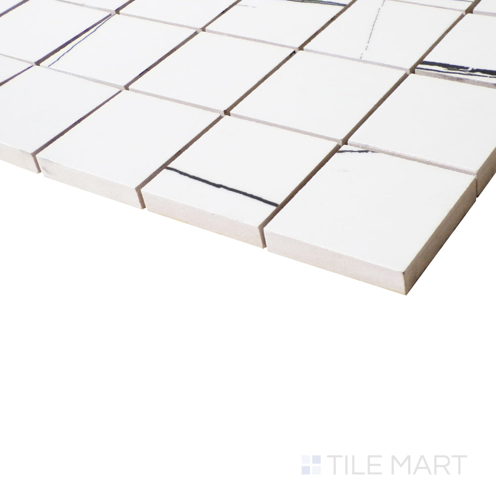 A close-up side view captures the seamless elegance of Sahara White mosaic tiles, with a polished sheen that enhances their bright tones.