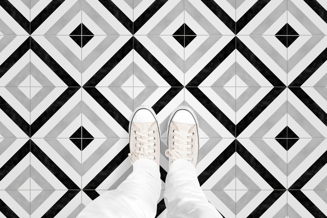 A bold interior composition highlighting Frame 15 Stripes B&W matte porcelain, enhancing spaces with a sleek and contemporary pattern.