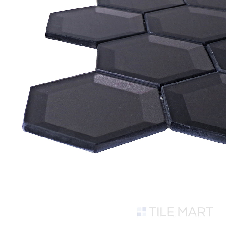 A corner shot of the Bold Glass Black 3" hexagon glossy mosaic tile highlights its deep black hue and reflective surface, adding a bold and modern touch to accent walls and backsplashes.