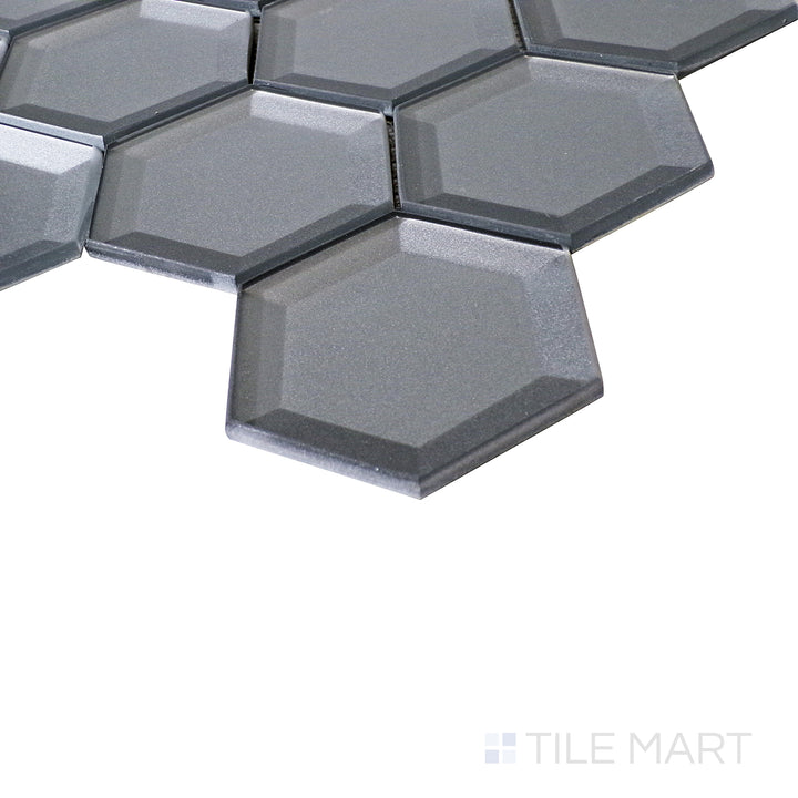 An angled close-up highlights the rich dark grey tones, while the glossy finish enhances the geometric elegance.