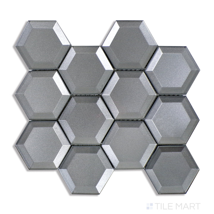 Top-down shot of Bold Glass Dark Grey 3" Hexagon Glossy Mosaic, showcasing deep grey tones with a high-gloss finish for a sleek modern look.