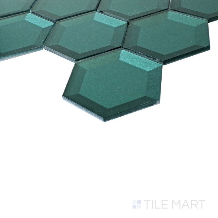 Under soft lighting, the green hexagon tiles appear sleek and radiant, showcasing their lustrous glass finish.