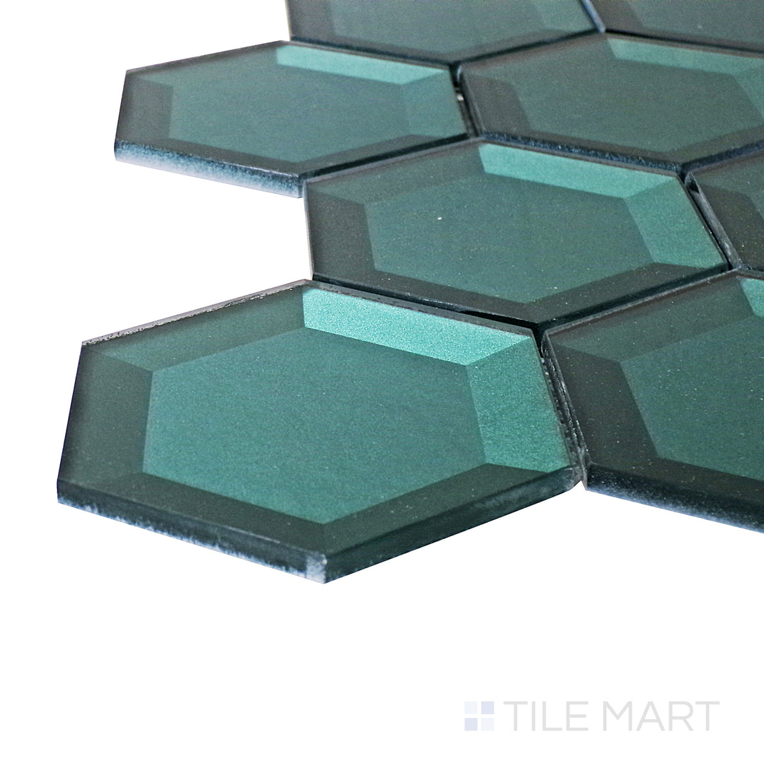 Captured from a corner angle, the Bold Glass Green 3" hexagon glossy mosaic tile showcases its deep green hue and lustrous glaze, offering a vibrant and refreshing aesthetic.