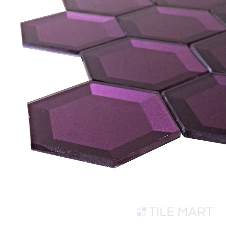 A corner perspective of the Bold Glass Purple 3" hexagon glossy mosaic tile emphasizes its bold purple shade and glossy texture, making it a standout choice for artistic and unique tile designs.