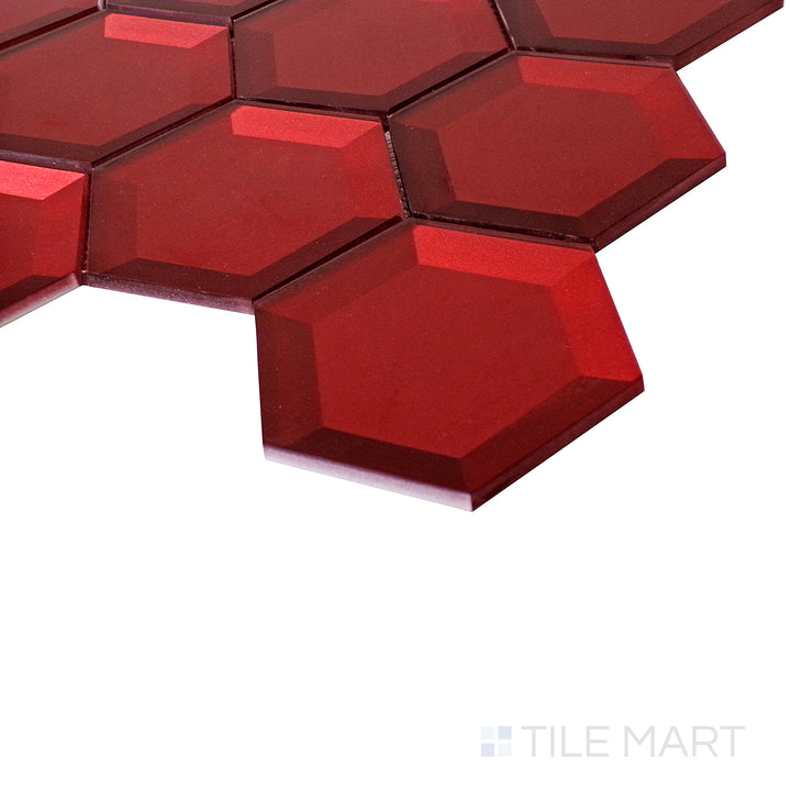 The bold red hexagon tiles glow with a rich glassy finish, enhanced by the light from an angled perspective.