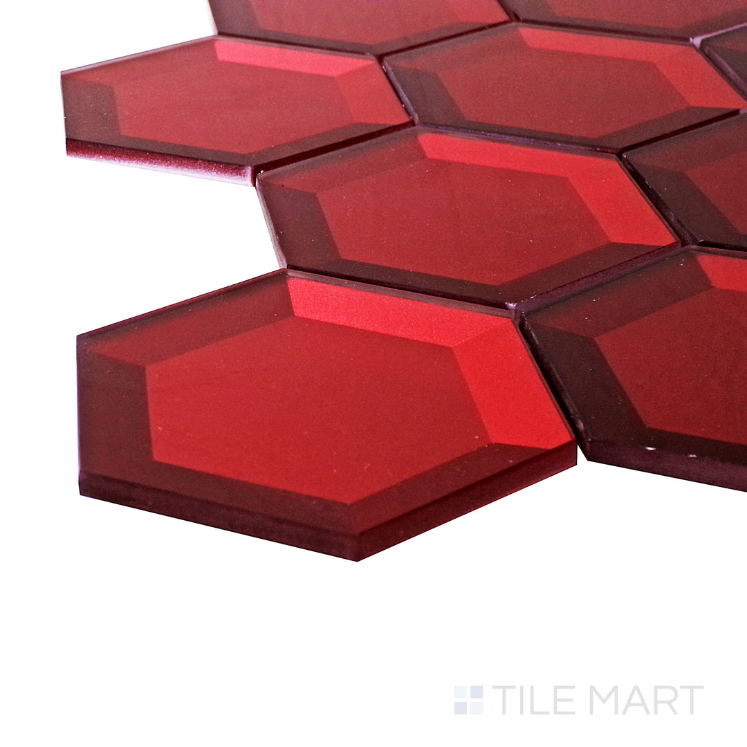 A corner shot of the Bold Glass Red 3" hexagon glossy mosaic tile highlights its rich red hue and reflective finish, adding warmth and drama to contemporary and eclectic spaces.