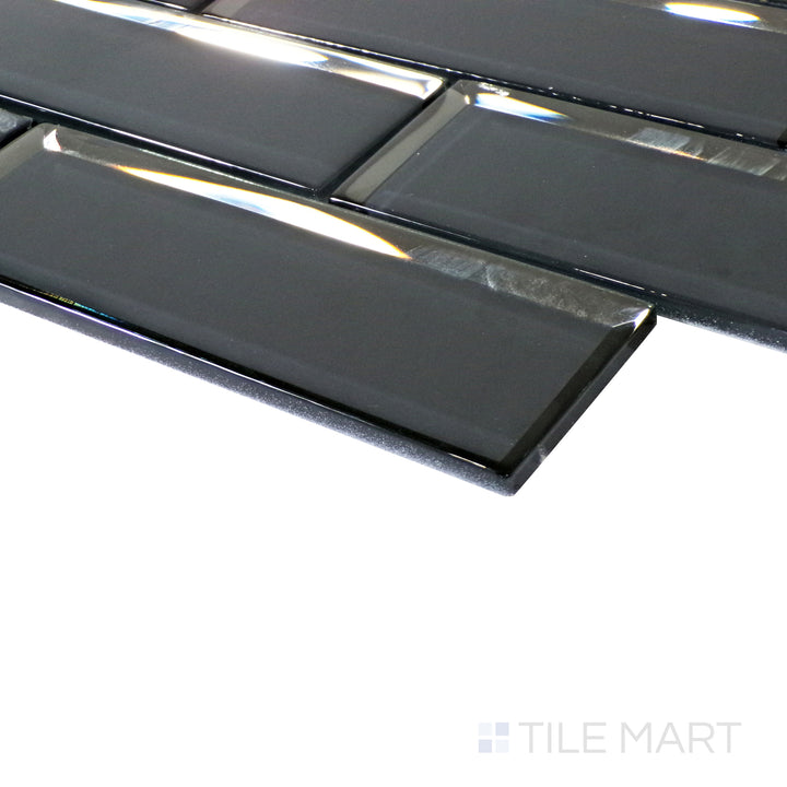 A close-up captures the dark grey tones, with a reflective glass finish that adds a dynamic touch to the brick pattern.