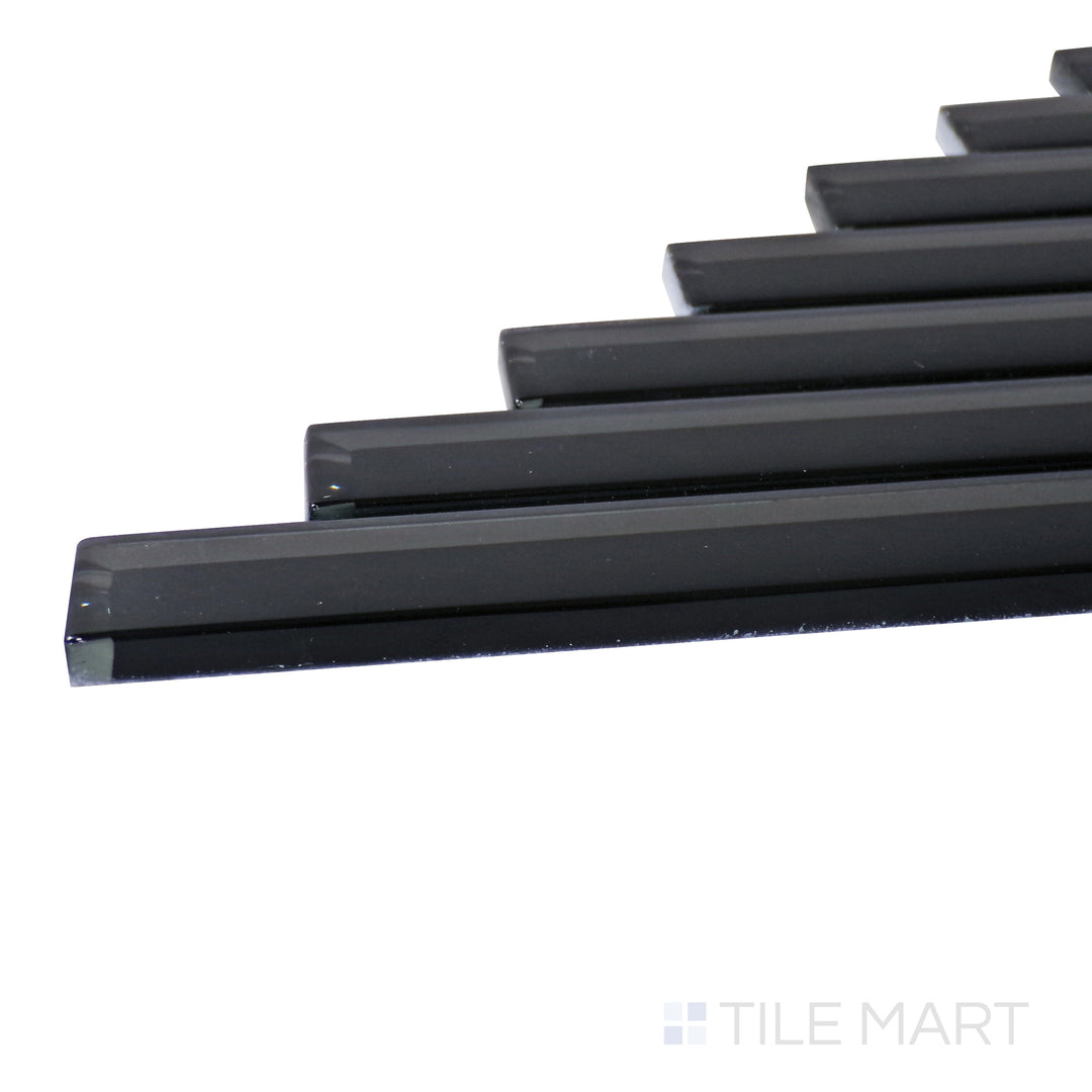 A corner shot of the Modern Glass Black Herringbone glossy mosaic tile highlights its deep black tones and intricate herringbone pattern, delivering a bold and sophisticated statement.