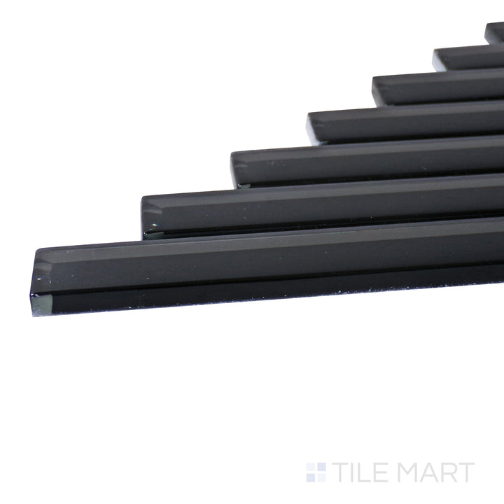 A corner shot of the Modern Glass Black Herringbone glossy mosaic tile highlights its deep black tones and intricate herringbone pattern, delivering a bold and sophisticated statement.