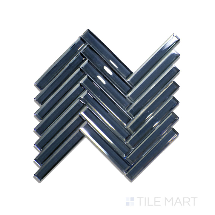 Overhead shot of Modern Glass Blue Herringbone Glossy Mosaic, presenting a deep blue hue with a reflective surface arranged in a sleek herringbone design.
