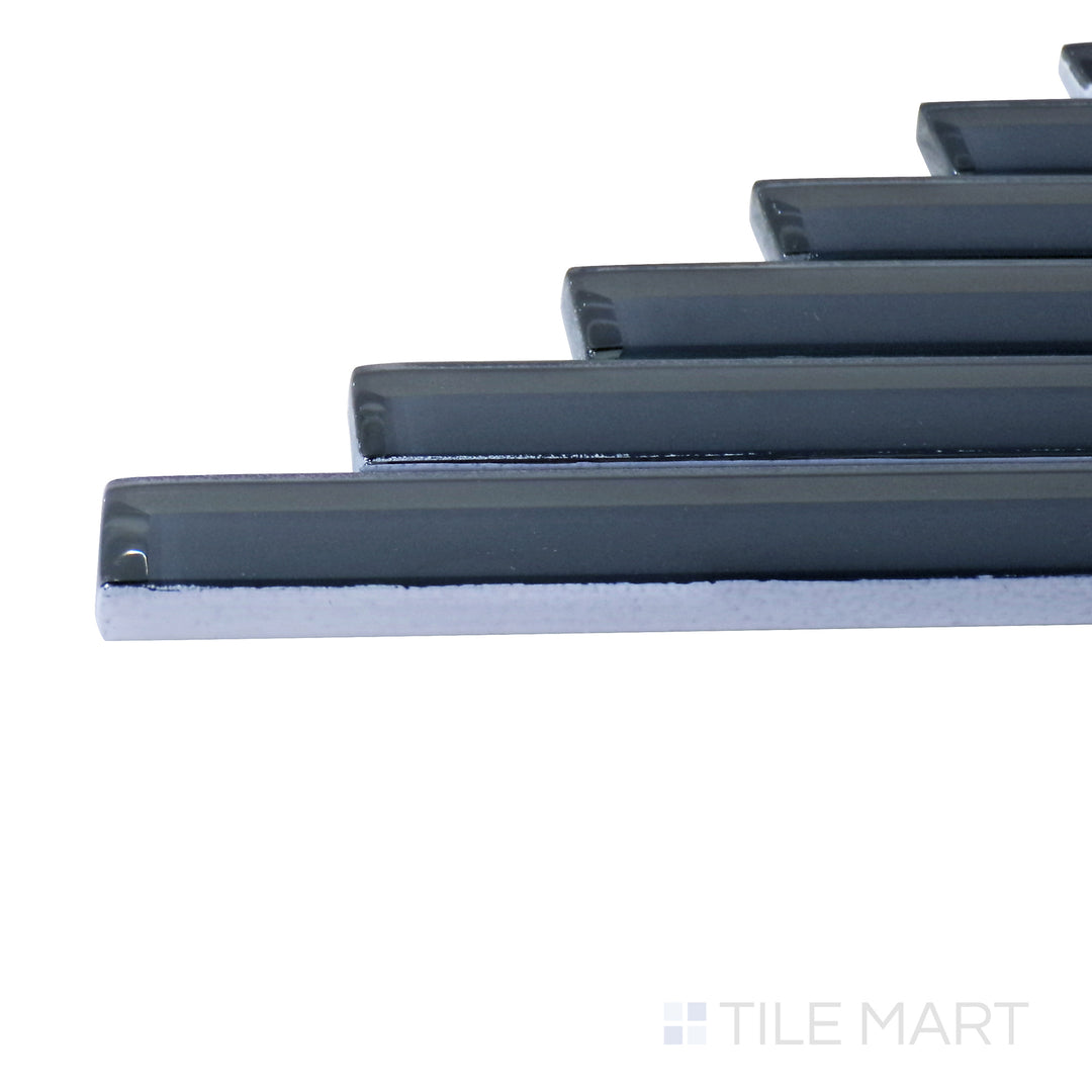 Captured from a corner angle, the Modern Glass Blue Herringbone glossy mosaic tile showcases its vibrant blue shade and dynamic herringbone design, offering a contemporary and artistic appeal.