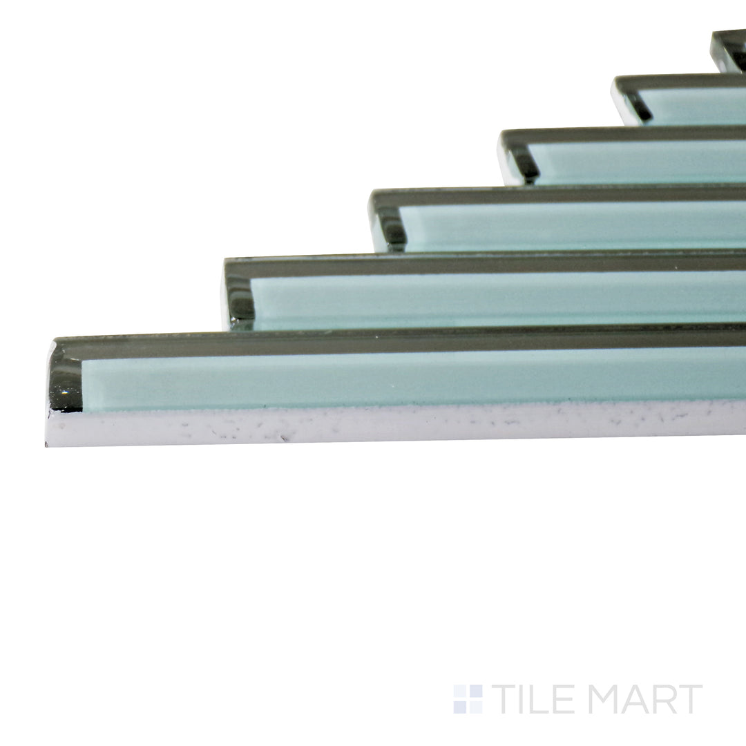 A corner shot of the Modern Glass Green Herringbone glossy mosaic tile highlights its striking green hue and intricate herringbone pattern, adding depth and visual interest.