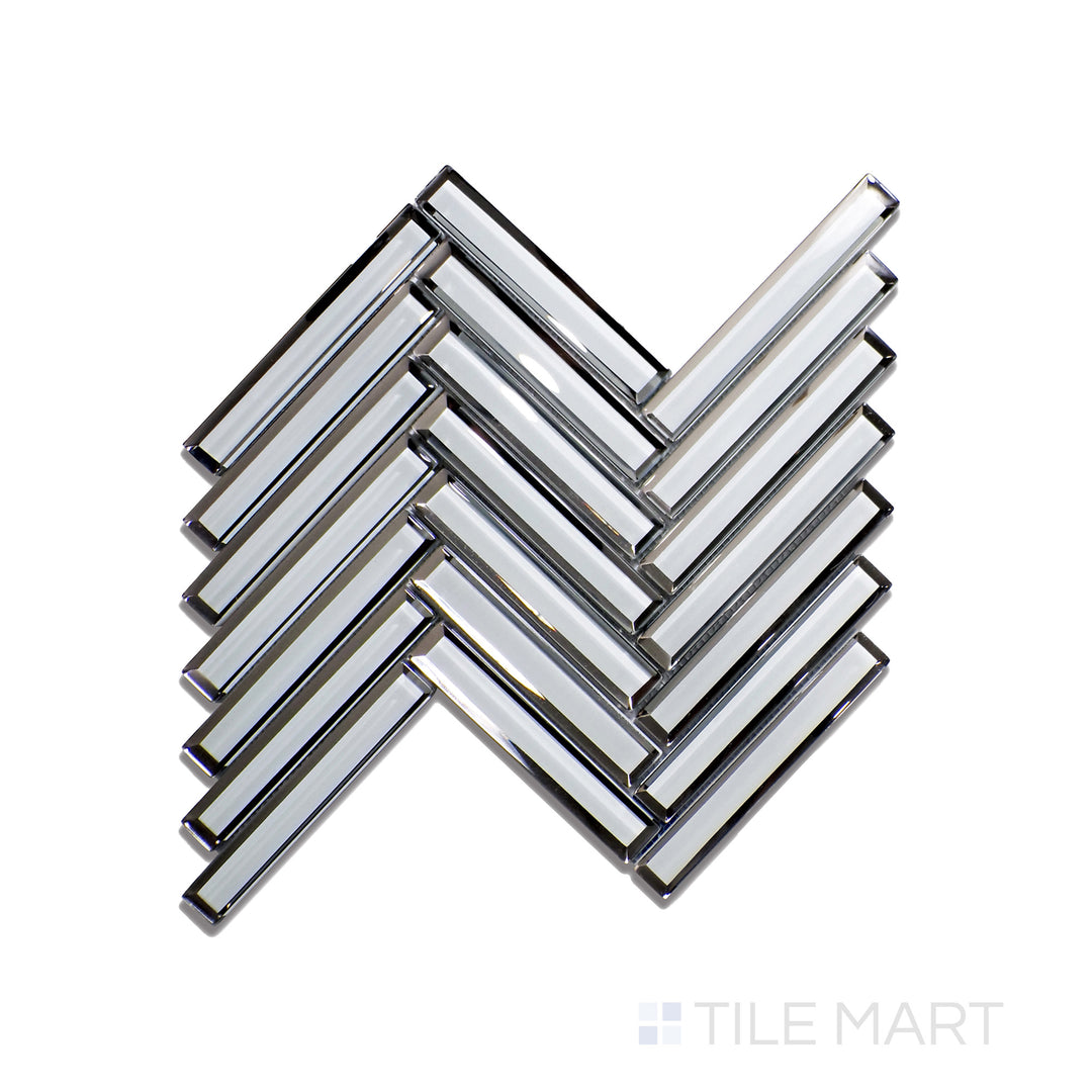 Top-down view of Modern Glass Grey Herringbone Glossy Mosaic, featuring soft grey shades with a modern glossy glaze in a refined herringbone pattern.