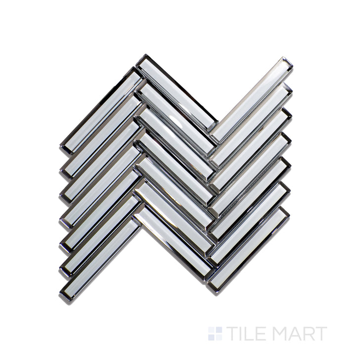 Top-down view of Modern Glass Grey Herringbone Glossy Mosaic, featuring soft grey shades with a modern glossy glaze in a refined herringbone pattern.