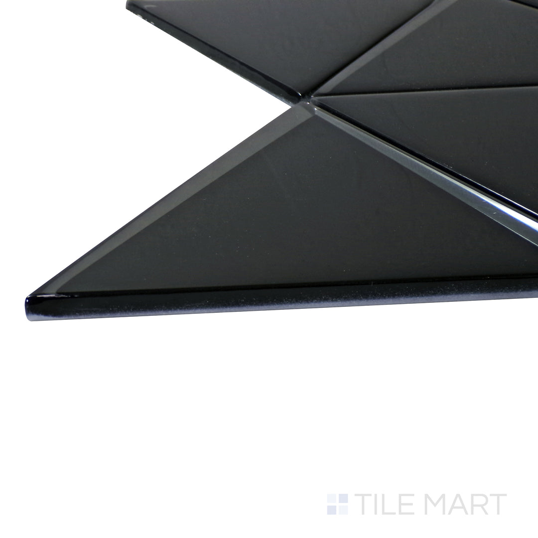 A corner shot of the Modern Glass Black 6" Triangle glossy mosaic tile highlights its deep black shade and sleek triangular design, perfect for bold and modern spaces.